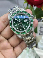 Rolex Submariner Date, 18K White Gold Diamonds Emerald UNWORN, 40mm