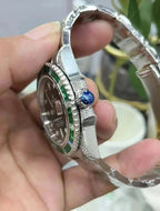 Rolex Submariner Date, 18K White Gold Diamonds Emerald UNWORN, 40mm