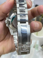 Rolex Submariner Date, 18K White Gold Diamonds Emerald UNWORN, 40mm