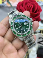 Rolex Submariner Date, 18K White Gold Diamonds Emerald UNWORN, 40mm